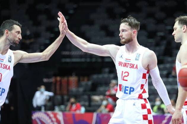 PXL_Croatia v Tunisia - Group A: 2020 FIBA Men s Olympic Qualifying Tournaments SPLIT, CROATIA - JULY 01: Croatian players Roko Leni Ukic and Pavle Marcinkovic congratulated each other on the game after the 2020 FIBA Men s Olympic Qualifying Tournament game between Croatia and Tunisia at Spaladium Arena on July 1, 2021 in Split, Croatia. IvoxCagalj PIXSELL