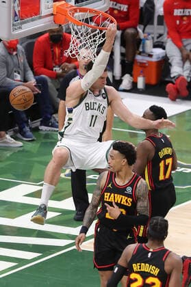 July 1, 2021, Milwaukee, WI, USA: The Milwaukee Bucks Brook Lopez (11) hangs on the basket after dunking against the Atlanta Hawks John Collins (20) during the third quarter in Game 5 of the NBA, Basketball Herren, USA Eastern Conference Finals at Fiserv Forum on Thursday, July 1, 2021, in Milwaukee. The Bucks won, 123-112, for a 3-2 series lead. Milwaukee USA - ZUMAm67_ 0123798650st Copyright: xCurtisxComptonx
