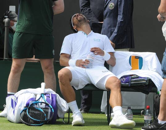 Tennis - 2021 All England Championships - Week One - Day Five (Friday) - Wimbledon Fabio Fognini v Andre Rublev Fabio Fognini of Italy in pain , waits for the physio 