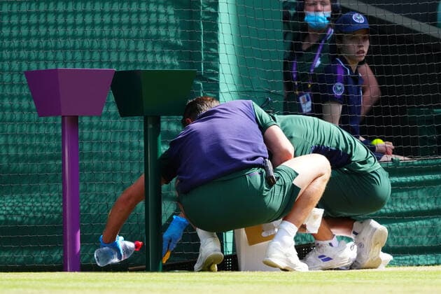 Mandatory Credit: Photo by Javier Garcia Shutterstock (12193040ds) Ground staff clean-up when Ons Jabeur was sick in her third round match Wimbledon Tennis Championships, Day 5, The All England Lawn Tennis and Croquet Club, London, UK - 02 Jul 2021 Wimbledon Tennis Championships, Day 5, The All England Lawn Tennis and Croquet Club, London, UK - 02 Jul 2021  Copyright: xJavierxGarcia Shutterstockx 12193040ds