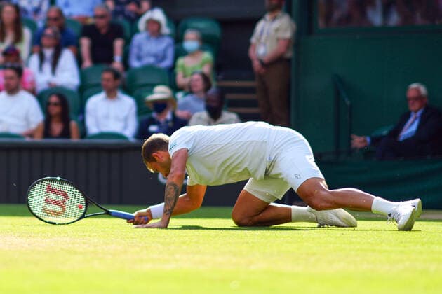 Mandatory Credit: Photo by Javier Garcia Shutterstock (12193040fz) Dan Evans slipping over during his third round match Wimbledon Tennis Championships, Day 5, The All England Lawn Tennis and Croquet Club, London, UK - 02 Jul 2021 Wimbledon Tennis Championships, Day 5, The All England Lawn Tennis and Croquet Club, London, UK - 02 Jul 2021  Copyright: xJavierxGarcia Shutterstockx 12193040fz