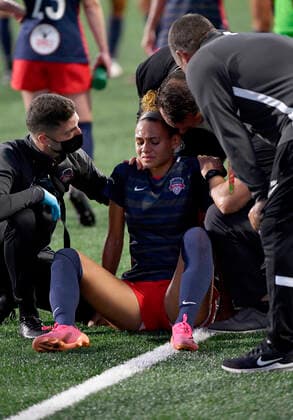 LEESBURG, VA - JULY 02: Washington Spirit head coach Richie Burke talks to Trinity Rodman (2) after she injured her back during the Chicago Red Stars versus Washington Spirit NWSL match on July 2, 2021 at Segra Field in Leesburg, VA. (Photo by Randy Litzinger Icon Sportswire) SOCCER: JUL 02 NWSL - Chicago Red Stars at Washington Spirit Icon9662107020649