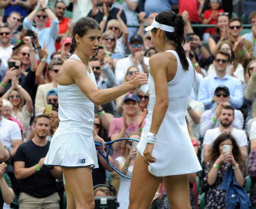 Tennis - 2021 All England Championships - Week One - Day Six (Saturday) - Wimbledon Ladies Singles Sorana Cirstea v Emma Raducanu Sorana Cirstea congratulates Emma Raducanu winning the match 