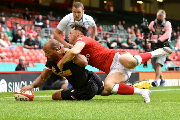 Rugby Union - 2021 Summer International - Wales vs Canada - Principality Stadium Kaiona Lloyd ; scores a try despite the tackle of Tom Rogers (Scarlets); COLORSPORT WINSTON BYNORTH 