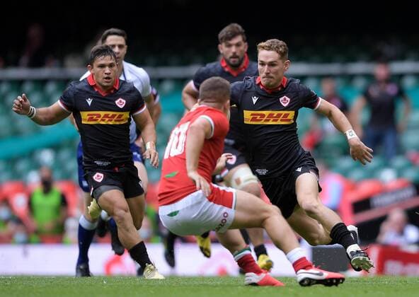 Mandatory Credit: Photo by Ryan Hiscott JMP Shutterstock (12194685a) Cooper Coats of Canada is marked by Callum Sheedy of Wales Wales v Canada, UK - 03 Jul 2021 Wales v Canada, UK - 03 Jul 2021  Copyright: xRyanxHiscott JMP Shutterstockx 12194685a