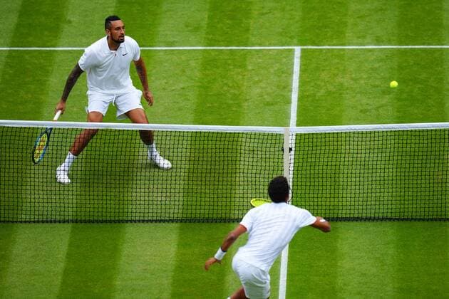 Mandatory Credit: Photo by Javier Garcia Shutterstock (12194408de) Nick Kyrgios and Felix Auger-Aliassime during their third round match Wimbledon Tennis Championships, Day 6, The All England Lawn Tennis and Croquet Club, London, UK - 03 Jul 2021 Wimbledon Tennis Championships, Day 6, The All England Lawn Tennis and Croquet Club, London, UK - 03 Jul 2021  Copyright: xJavierxGarcia Shutterstockx 12194408de