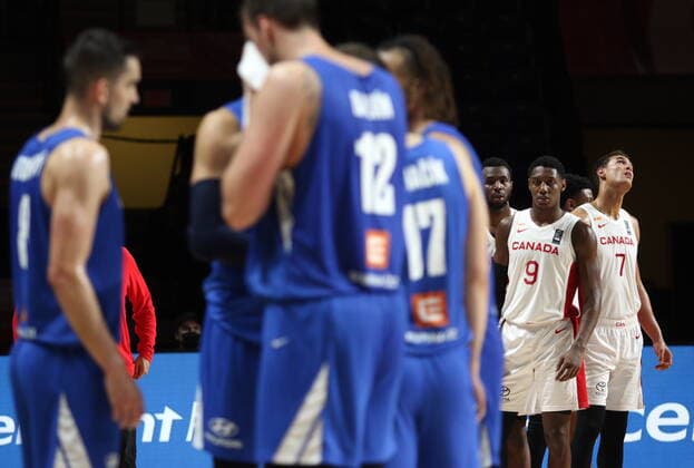 July 3, 2021, Victoria, BC, Canada: Canada s Andrew Wiggins, RJ Barrett, and Dwight Powell look on during a timeout between the Czech Republic during the second half of FIBA Men s Olympic Qualifying semifinal basketball action at Memorial Arena in Victoria, B.C., on Saturday, July 3, 2021. Andrew Wiggins,RJ Barrett,Dwight Powell  - ZUMAc35_ 20210703_zaf_c35_031 Copyright: xChadxHipolitox