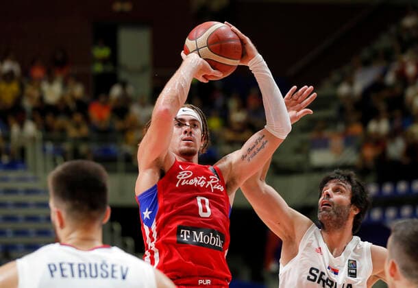 (210704) -- BELGRADE, July 4, 2021 -- Puerto Rico s Isaiah Pineiro (C) scores past Serbia s Milos Teodosic (R) during FIBA Olympic Qualifying Tournament basketball semi-final match between Serbia and Puerto Rico in Belgrade, Serbia on July 3, 2021. (Photo by Xinhua) (SP)SERBIA-BELGRADE-BASKETBALL-FIBA OQT-SEMI-FINALS-SERBIA VS PUERTO RICO PredragxMilosavljevic 