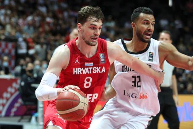 (210704) -- SPLIT, July 4, 2021 -- Mario Hezonja (L) of Croatia vies with Johannes Thiemann of Germany during the 2020 FIBA Olympic Qualifying Tournament semi-final match between Croatia and Germany in Split, Croatia, July 3, 2021. ( Pixsell via Xinhua) (SP) CROATIA-SPLIT-FIBA OQT-SEMI-FINALS-CROATIA VS GERMANY IvoxCagalj 