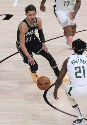 July 3, 2021, Atlanta, GA, USA: The Atlanta Hawks Trae Young (11) works against the Milwaukee Bucks Jrue Holiday (21) in Game 6 of the Eastern Conference Finals on Saturday, July 3, 2021, at State Farm Arena in Atlanta. The Bucks advanced, 118-107. Atlanta USA - ZUMAm67_ 0124090252st Copyright: xCurtisxComptonx