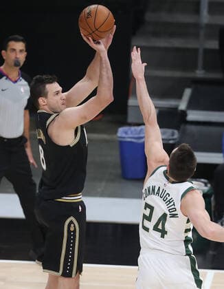 July 3, 2021, Atlanta, GA, USA: The Atlanta Hawks Danilo Gallinari, left, hits a 3-point shot over the Milwaukee Bucks Pat Connaughton during the first quarter in Game 6 of the Eastern Conference Finals on Saturday, July 3, 2021, at State Farm Arena in Atlanta. The Bucks advanced, 118-107. Atlanta USA - ZUMAm67_ 0124090259st Copyright: xCurtisxComptonx