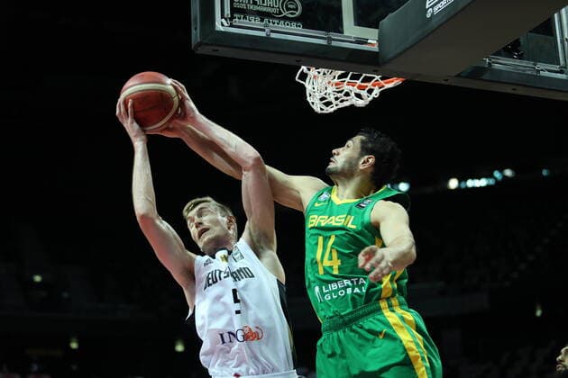 Germany v Brazil - Final: 2020 FIBA Men s Olympic Qualifying Tournament Niels Giffey of Germany reaches for the ball over Leonardo Meindl of Brazil during the 2020 FIBA Men s Olympic Qualifying Tournament final between Germany and Brazil at Spaladium Arena on July 4, 2021 in Split, Croatia. IvoxCagalj PIXSELL