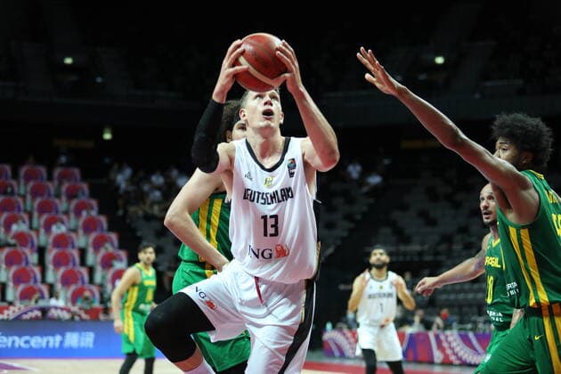 (210705) -- SPLIT (CROATIA), July 5, 2021 -- Moritz Wagner (L, front) of Germany goes for a layup during the 2020 FIBA Men s Olympic Qualifying Tournament final match between Germany and Brazil in Split, Croatia, July 4, 2021. ( Pixsell via Xinhua) (SP)CROATIA-SPLIT-FIBA OQT-FINALS-BRAZIL VS GERMANY IvoxCagalj 