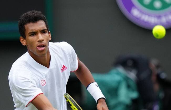 Mandatory Credit: Photo by Shutterstock (12196118dv) Felix Auger-Aliassime during his fourth round match Wimbledon Tennis Championships, Day 7, The All England Lawn Tennis and Croquet Club, London, UK - 05 Jul 2021 Wimbledon Tennis Championships, Day 7, The All England Lawn Tennis and Croquet Club, London, UK - 05 Jul 2021  Copyright: xShutterstockx 12196118dv