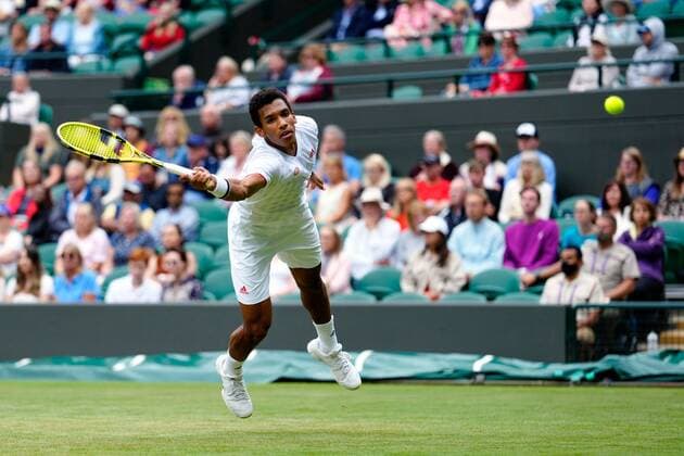 Mandatory Credit: Photo by Shutterstock (12196118es) Felix Auger-Aliassime during his fourth round match Wimbledon Tennis Championships, Day 7, The All England Lawn Tennis and Croquet Club, London, UK - 05 Jul 2021 Wimbledon Tennis Championships, Day 7, The All England Lawn Tennis and Croquet Club, London, UK - 05 Jul 2021  Copyright: xShutterstockx 12196118es