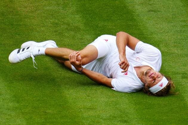 Mandatory Credit: Photo by Javier Garcia Shutterstock (12196117jv) Alexander Zverev oin the ground, injured, during his fourth round match Wimbledon Tennis Championships, Day 7, The All England Lawn Tennis and Croquet Club, London, UK - 05 Jul 2021 Wimbledon Tennis Championships, Day 7, The All England Lawn Tennis and Croquet Club, London, UK - 05 Jul 2021 Copyright: xJavierxGarcia Shutterstockx 12196117jv
