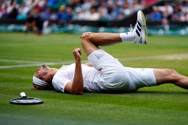 Mandatory Credit: Photo by Shutterstock (12196118eu) Alexander Zverev oin the ground, injured, during his fourth round match Wimbledon Tennis Championships, Day 7, The All England Lawn Tennis and Croquet Club, London, UK - 05 Jul 2021 Wimbledon Tennis Championships, Day 7, The All England Lawn Tennis and Croquet Club, London, UK - 05 Jul 2021 Copyright: xShutterstockx 12196118eu