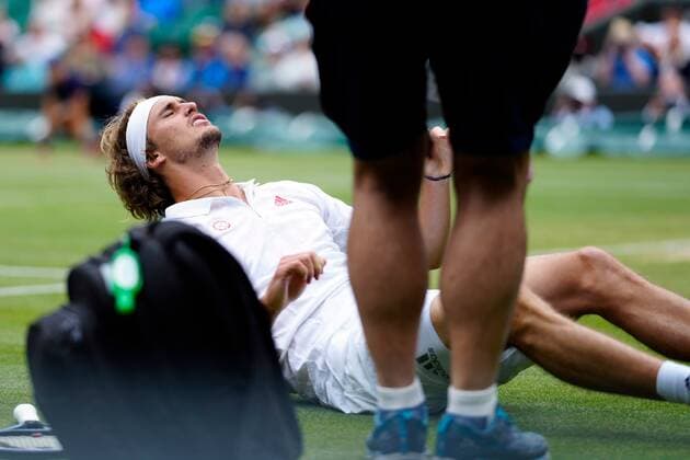 Mandatory Credit: Photo by Shutterstock (12196118et) Alexander Zverev oin the ground, injured, during his fourth round match Wimbledon Tennis Championships, Day 7, The All England Lawn Tennis and Croquet Club, London, UK - 05 Jul 2021 Wimbledon Tennis Championships, Day 7, The All England Lawn Tennis and Croquet Club, London, UK - 05 Jul 2021  Copyright: xShutterstockx 12196118et