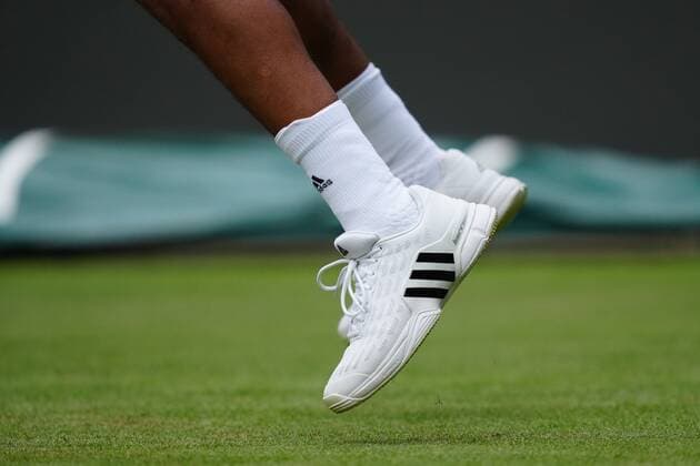 Mandatory Credit: Photo by Shutterstock (12196118fd) The Adidas tennis shoes of Felix Auger-Aliassime during his fourth round match Wimbledon Tennis Championships, Day 7, The All England Lawn Tennis and Croquet Club, London, UK - 05 Jul 2021 Wimbledon Tennis Championships, Day 7, The All England Lawn Tennis and Croquet Club, London, UK - 05 Jul 2021  Copyright: xShutterstockx 12196118fd
