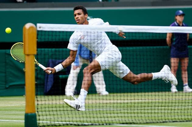 Mandatory Credit: Photo by Shutterstock (12196118fu) Felix Auger-Aliassime during his fourth round match Wimbledon Tennis Championships, Day 7, The All England Lawn Tennis and Croquet Club, London, UK - 05 Jul 2021 Wimbledon Tennis Championships, Day 7, The All England Lawn Tennis and Croquet Club, London, UK - 05 Jul 2021  Copyright: xShutterstockx 12196118fu