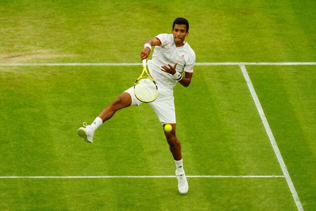 Mandatory Credit: Photo by Javier Garcia Shutterstock (12196117li) Felix Auger-Aliassime plays the match winning point during his fourth round match Wimbledon Tennis Championships, Day 7, The All England Lawn Tennis and Croquet Club, London, UK - 05 Jul 2021 Wimbledon Tennis Championships, Day 7, The All England Lawn Tennis and Croquet Club, London, UK - 05 Jul 2021  Copyright: xJavierxGarcia Shutterstockx 12196117li