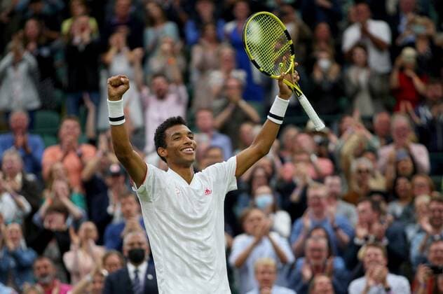 Mandatory Credit: Photo by Shutterstock (12196120aj) Felix Auger Aliassime of Canada celebrates on match point Wimbledon Tennis Championships, Day 7, The All England Lawn Tennis and Croquet Club, London, UK - 05 Jul 2021 Wimbledon Tennis Championships, Day 7, The All England Lawn Tennis and Croquet Club, London, UK - 05 Jul 2021  Copyright: xShutterstockx 12196120aj