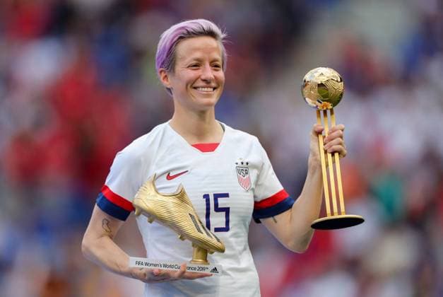 Mandatory Credit: Photo by BPI Shutterstock (10329049gj) Megan Rapinoe of USA celebrates with the Player of the Tournament trophy and Golden Boot USA v Netherlands, FIFA Women s World Cup Final, Football, Stade de Lyon, France - 07 Jul 2019 USA v Netherlands, FIFA Women s World Cup Final, Football, Stade de Lyon, France - 07 Jul 2019  Copyright: xBPI Shutterstockx 10329049gj