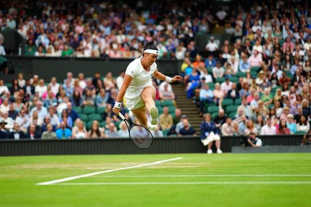 Mandatory Credit: Photo by Javier Garcia Shutterstock (12197711bf) Ons Jabeur plays the ball through her legs during her quarter-final match Wimbledon Tennis Championships, Day 8, The All England Lawn Tennis and Croquet Club, London, UK - 06 Jul 2021 Wimbledon Tennis Championships, Day 8, The All England Lawn Tennis and Croquet Club, London, UK - 06 Jul 2021  Copyright: xJavierxGarcia Shutterstockx 12197711bf