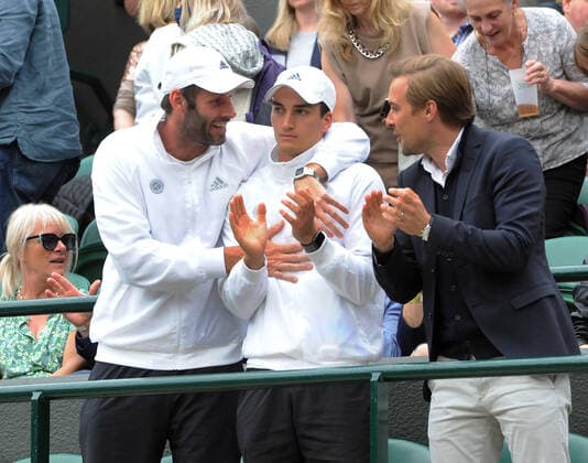 Lawn Tennis - 2021 All England Championships - Week Two - Tuesday - Wimbledon Ladies - Karolina Muchova v Angelique Kerber Angelique Kerber s coaches in the players box celebrate her victory Torben Beltz (left) 