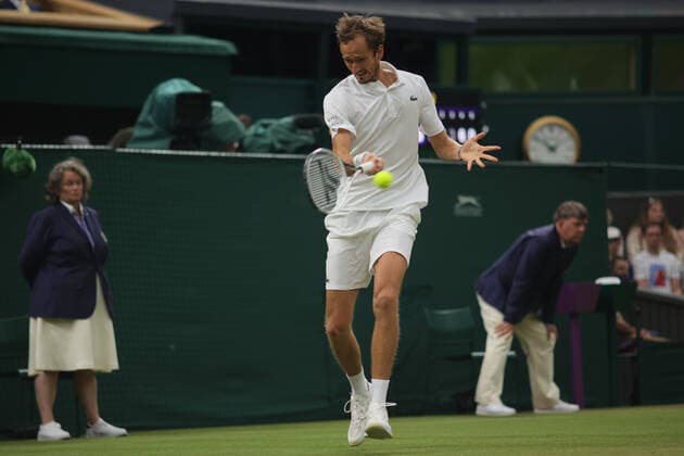 (210707) -- LONDON, July 7, 2021 -- Daniil Medvedev of Russia hits a return during the men s singles fourth round match between Hubert Hurkacz of Poland and Daniil Medvedev of Russia at Wimbledon tennis Championship in London, Britain, on July 6, 2021. (Photo by Xinhua) (SP)BRITAIN-LONDON-TENNIS-WIMBLEDON TimxIreland 