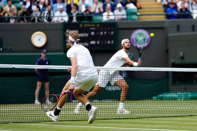 Mandatory Credit: Photo by Shutterstock (12199111cs) Denis Shapovalov and Karen Khachanov during their quarter-final match Wimbledon Tennis Championships, Day 9, The All England Lawn Tennis and Croquet Club, London, UK - 07 Jul 2021 Wimbledon Tennis Championships, Day 9, The All England Lawn Tennis and Croquet Club, London, UK - 07 Jul 2021  Copyright: xShutterstockx 12199111cs