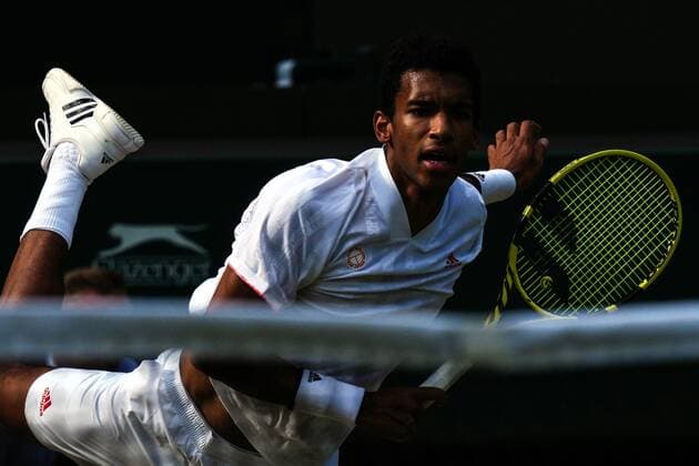 Mandatory Credit: Photo by Shutterstock (12199111gb) Felix Auger-Aliassime during his quarter-final match Wimbledon Tennis Championships, Day 9, The All England Lawn Tennis and Croquet Club, London, UK - 07 Jul 2021 Wimbledon Tennis Championships, Day 9, The All England Lawn Tennis and Croquet Club, London, UK - 07 Jul 2021  Copyright: xShutterstockx 12199111gb