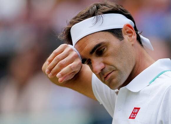 Mandatory Credit: Photo by Shutterstock (12199112am) Roger Federer of Switzerland frustrated Wimbledon Tennis Championships, Day 9, The All England Lawn Tennis and Croquet Club, London, UK - 07 Jul 2021 Wimbledon Tennis Championships, Day 9, The All England Lawn Tennis and Croquet Club, London, UK - 07 Jul 2021  Copyright: xShutterstockx 12199112am