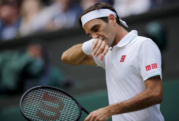 Mandatory Credit: Photo by Shutterstock (12199112ao) Roger Federer of Switzerland frustrated Wimbledon Tennis Championships, Day 9, The All England Lawn Tennis and Croquet Club, London, UK - 07 Jul 2021 Wimbledon Tennis Championships, Day 9, The All England Lawn Tennis and Croquet Club, London, UK - 07 Jul 2021  Copyright: xShutterstockx 12199112ao