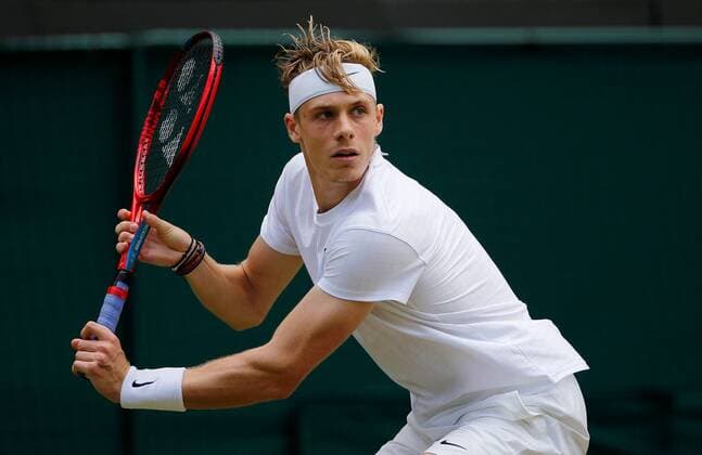 Mandatory Credit: Photo by Shutterstock (12199112r) Denis Shapovalov of Canada in action Wimbledon Tennis Championships, Day 9, The All England Lawn Tennis and Croquet Club, London, UK - 07 Jul 2021 Wimbledon Tennis Championships, Day 9, The All England Lawn Tennis and Croquet Club, London, UK - 07 Jul 2021  Copyright: xShutterstockx 12199112r