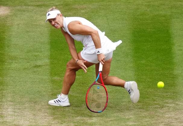Mandatory Credit: Photo by Shutterstock (12200579i) Angelique Kerber during her semi-final match Wimbledon Tennis Championships, Day 10, The All England Lawn Tennis and Croquet Club, London, UK - 08 Jul 2021 Wimbledon Tennis Championships, Day 10, The All England Lawn Tennis and Croquet Club, London, UK - 08 Jul 2021  Copyright: xShutterstockx 12200579i