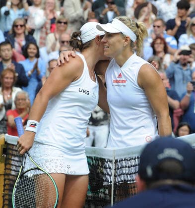 Lawn Tennis - 2021 All England Championships - Week Two - Thursday - Wimbledon - Ladies Semi Final . Ashleigh Barty v Angelique Kerber Ashleigh Barty of Australia is congratulated by Angelique Kerber at the net after the match 