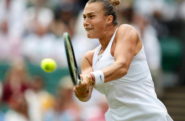 (210709) -- LONDON, July 9, 2021 -- Aryna Sabalenka of Belarus hits a return during the women s singles semifinal between Aryna Sabalenka of Belarus and Karolina Pliskova of Czech Republic at Wimbledon tennis Championship in London, Britain, on July 8, 2021. ) (SP)BRITAIN-LONDON-TENNIS-WIMBLEDON-SEMIFINAL HanxYan 
