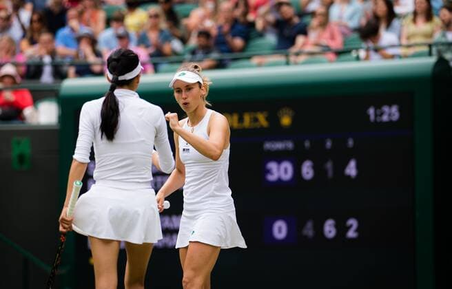 Mandatory Credit: Photo by Rob Prange Shutterstock (12202162p) Elise Mertens of Belgium & Su-Wei Hsieh of Chinese Taipeh in actin during the doubles semi-final of the 2021 Wimbledon Championships Grand Slam tennis tournament Wimbledon Tennis Championships, Day 11, The All England Lawn Tennis and Croquet Club, London, UK - 09 Jul 2021 Wimbledon Tennis Championships, Day 11, The All England Lawn Tennis and Croquet Club, London, UK - 09 Jul 2021  Copyright: xRobxPrange Shutterstockx 12202162p