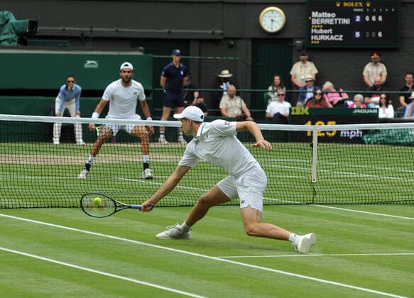 Lawn Tennis - 2021 All England Championships - Week Two - Friday - Wimbledon Mens Semi Final - Matteo Berrettini v Hubert Hurkacz Hubert Hurkacz returns to Matteo Berrettini of Italy 