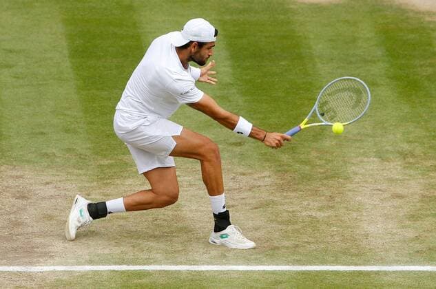 Mandatory Credit: Photo by Shutterstock (12202161i) Matteo Berrettini of Italy in action Wimbledon Tennis Championships, Day 11, The All England Lawn Tennis and Croquet Club, London, UK - 09 Jul 2021 Wimbledon Tennis Championships, Day 11, The All England Lawn Tennis and Croquet Club, London, UK - 09 Jul 2021  Copyright: xShutterstockx 12202161i