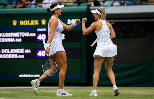 Mandatory Credit: Photo by Rob Prange Shutterstock (12202162ah) Storm Sanders of Australia & Caroline Dolehide of the United States in action during the doubles semi-final of the 2021 Wimbledon Championships Grand Slam tennis tournament Wimbledon Tennis Championships, Day 11, The All England Lawn Tennis and Croquet Club, London, UK - 09 Jul 2021 Wimbledon Tennis Championships, Day 11, The All England Lawn Tennis and Croquet Club, London, UK - 09 Jul 2021  Copyright: xRobxPrange Shutterstockx 12202162ah