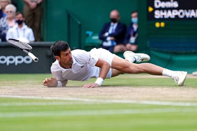 Mandatory Credit: Photo by Shutterstock (12202136dz) Novak Djokovic slips over during his semi-final match Wimbledon Tennis Championships, Day 11, The All England Lawn Tennis and Croquet Club, London, UK - 09 Jul 2021 Wimbledon Tennis Championships, Day 11, The All England Lawn Tennis and Croquet Club, London, UK - 09 Jul 2021  Copyright: xShutterstockx 12202136dz