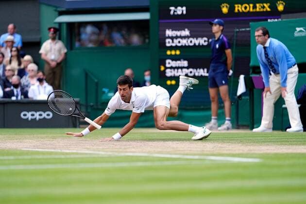Mandatory Credit: Photo by Shutterstock (12202136dx) Novak Djokovic slips over during his semi-final match Wimbledon Tennis Championships, Day 11, The All England Lawn Tennis and Croquet Club, London, UK - 09 Jul 2021 Wimbledon Tennis Championships, Day 11, The All England Lawn Tennis and Croquet Club, London, UK - 09 Jul 2021  Copyright: xShutterstockx 12202136dx