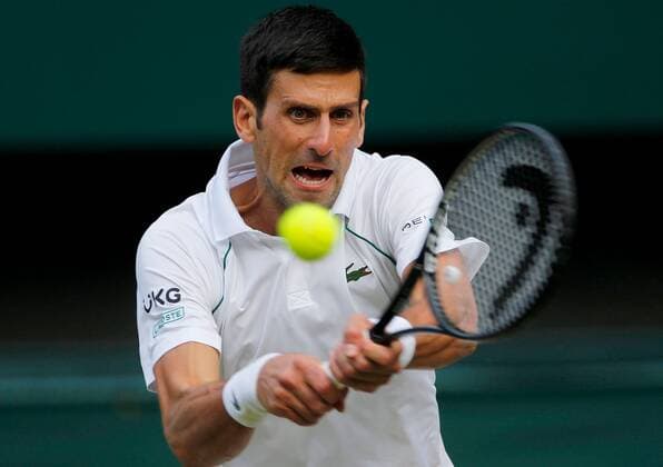 Mandatory Credit: Photo by Shutterstock (12202161bq) Novak Djokovic of Serbia in action Wimbledon Tennis Championships, Day 11, The All England Lawn Tennis and Croquet Club, London, UK - 09 Jul 2021 Wimbledon Tennis Championships, Day 11, The All England Lawn Tennis and Croquet Club, London, UK - 09 Jul 2021  Copyright: xShutterstockx 12202161bq