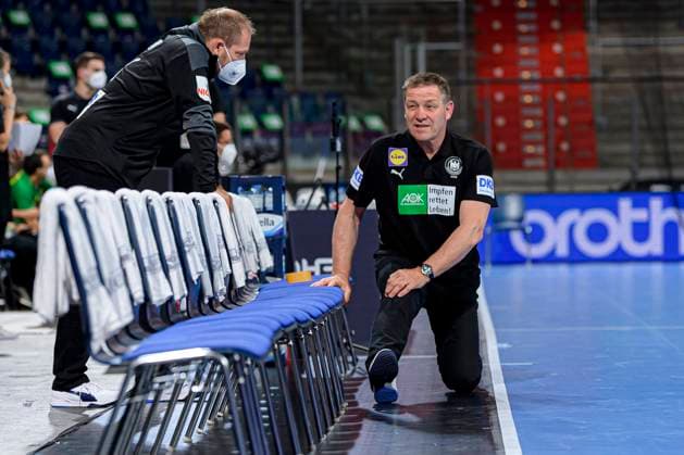 Nuremberg, Germany 09 July 2021 IHF Three Nations Tournament Germany vs Brazil v li goalkeeping coach MAttias Andersson Germany , coach Alfred Gislason Germany at stretching Nuremberg Arena Nürnberger Versicherung Bayern Germany.
