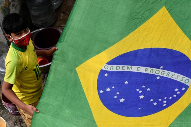 India: Brazil Football supporter support their team ahead of Copa America final in Kolkata A Supporter of Brazil wearing Brazil football jersey holding a Brazil national flag ahead of Copa America Football final match between Brazil and Argentina in Kolkata. Kolkata West Bengal India Copyright: SudiptaxDas