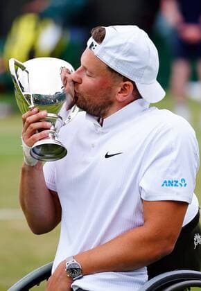 Mandatory Credit: Photo by Javier Garcia Shutterstock (12203621bf) Dylan Alcott celebrates with the trophy after victory in the Quad Wheelchair Singles final Wimbledon Tennis Championships, Day 12, The All England Lawn Tennis and Croquet Club, London, UK - 10 Jul 2021 Wimbledon Tennis Championships, Day 12, The All England Lawn Tennis and Croquet Club, London, UK - 10 Jul 2021  Copyright: xJavierxGarcia Shutterstockx 12203621bf