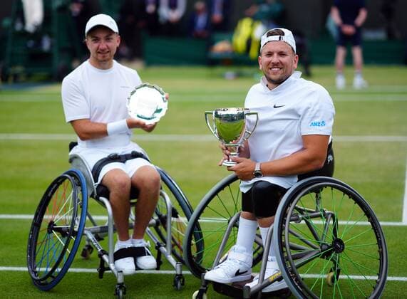 Mandatory Credit: Photo by Javier Garcia Shutterstock (12203621bi) Dylan Alcott celebrates with the trophy after victory in the Quad Wheelchair Singles final against Sam Schroder Wimbledon Tennis Championships, Day 12, The All England Lawn Tennis and Croquet Club, London, UK - 10 Jul 2021 Wimbledon Tennis Championships, Day 12, The All England Lawn Tennis and Croquet Club, London, UK - 10 Jul 2021  Copyright: xJavierxGarcia Shutterstockx 12203621bi
