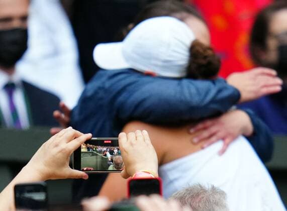 Mandatory Credit: Photo by Javier Garcia Shutterstock (12203621hq) Ashleigh Barty celebrates victory with her physio as a spectator films on their mobile phone Wimbledon Tennis Championships, Day 12, The All England Lawn Tennis and Croquet Club, London, UK - 10 Jul 2021 Wimbledon Tennis Championships, Day 12, The All England Lawn Tennis and Croquet Club, London, UK - 10 Jul 2021  Copyright: xJavierxGarcia Shutterstockx 12203621hq